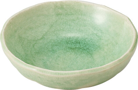 Green ceramic bowl on a white background