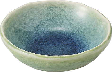 Ceramic bowl with a gradient blue to green color on a white background