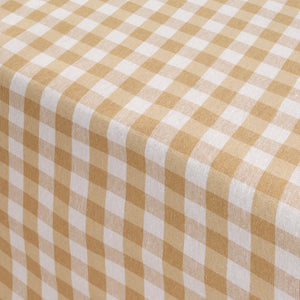 Close-up of a checkered tablecloth with beige and white pattern