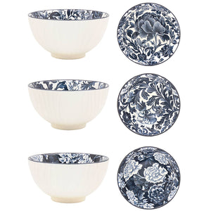 Set of ceramic bowls and plates with blue floral patterns on a white background