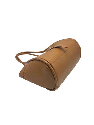 Brown leather cylindrical bag on a white background