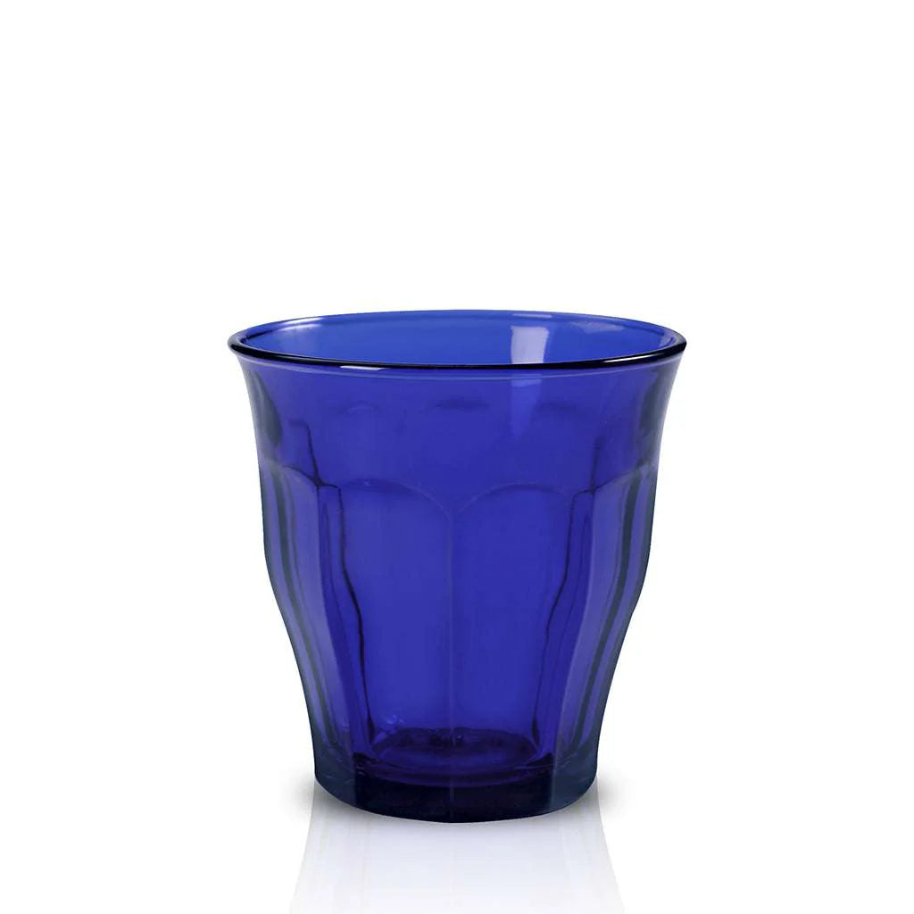 Blue glass tumbler on a white background