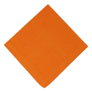 Solid orange square napkin on a white background