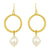 Gold hoop earrings with pearl drops on a white background