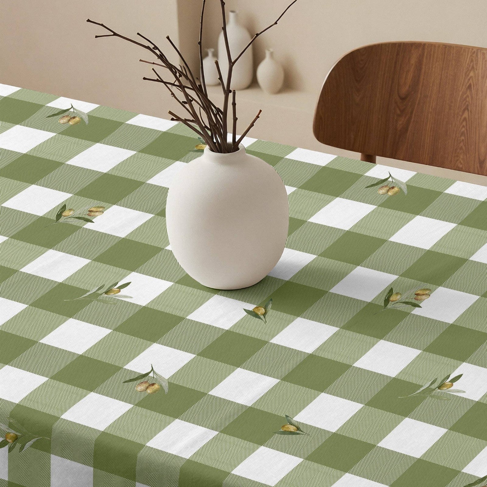 Green and white checkered tablecloth on a wooden table with chairs in a bright room.