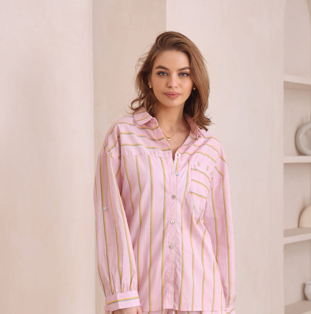 Woman wearing a pink striped shirt