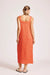 Woman wearing an orange dress on a white background