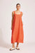 Woman wearing an orange dress against a white background