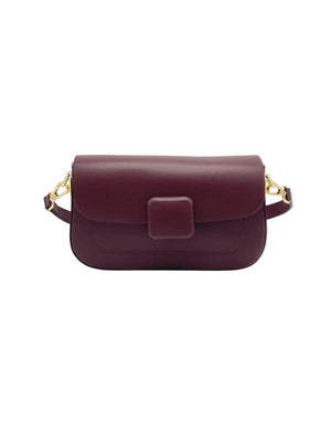 Burgundy handbag with gold accents on a white background