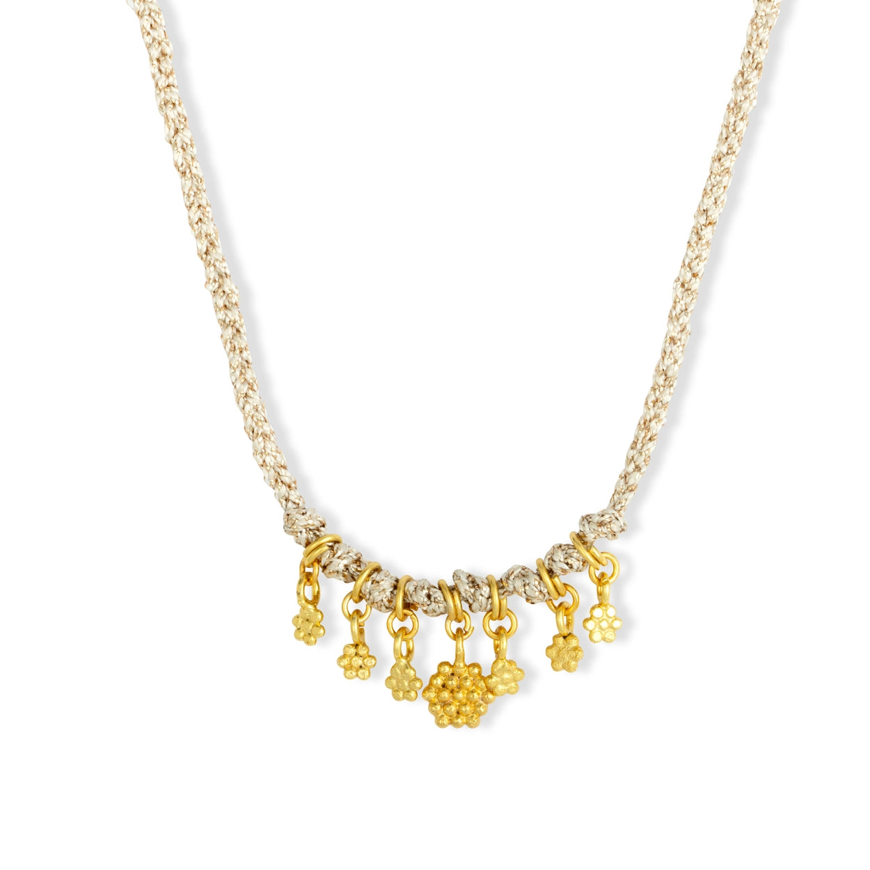 Gold necklace with floral pendants on a white background