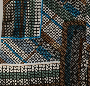 Close-up of a patterned fabric with circular designs in various colors.