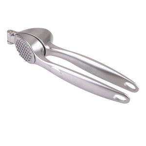 Stainless steel garlic press on a white background