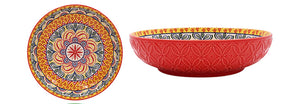 Set of colorful ceramic bowls and plates with intricate patterns on a white background