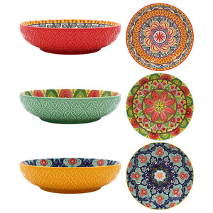 Set of colorful ceramic bowls with intricate patterns on a white background