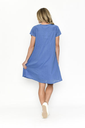 Woman wearing a blue dress on a white background