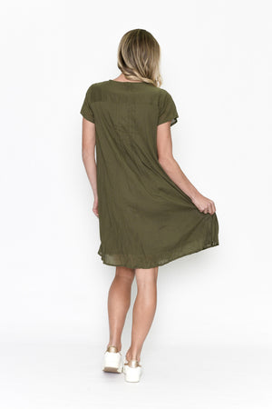 Woman wearing an olive green dress on a white background