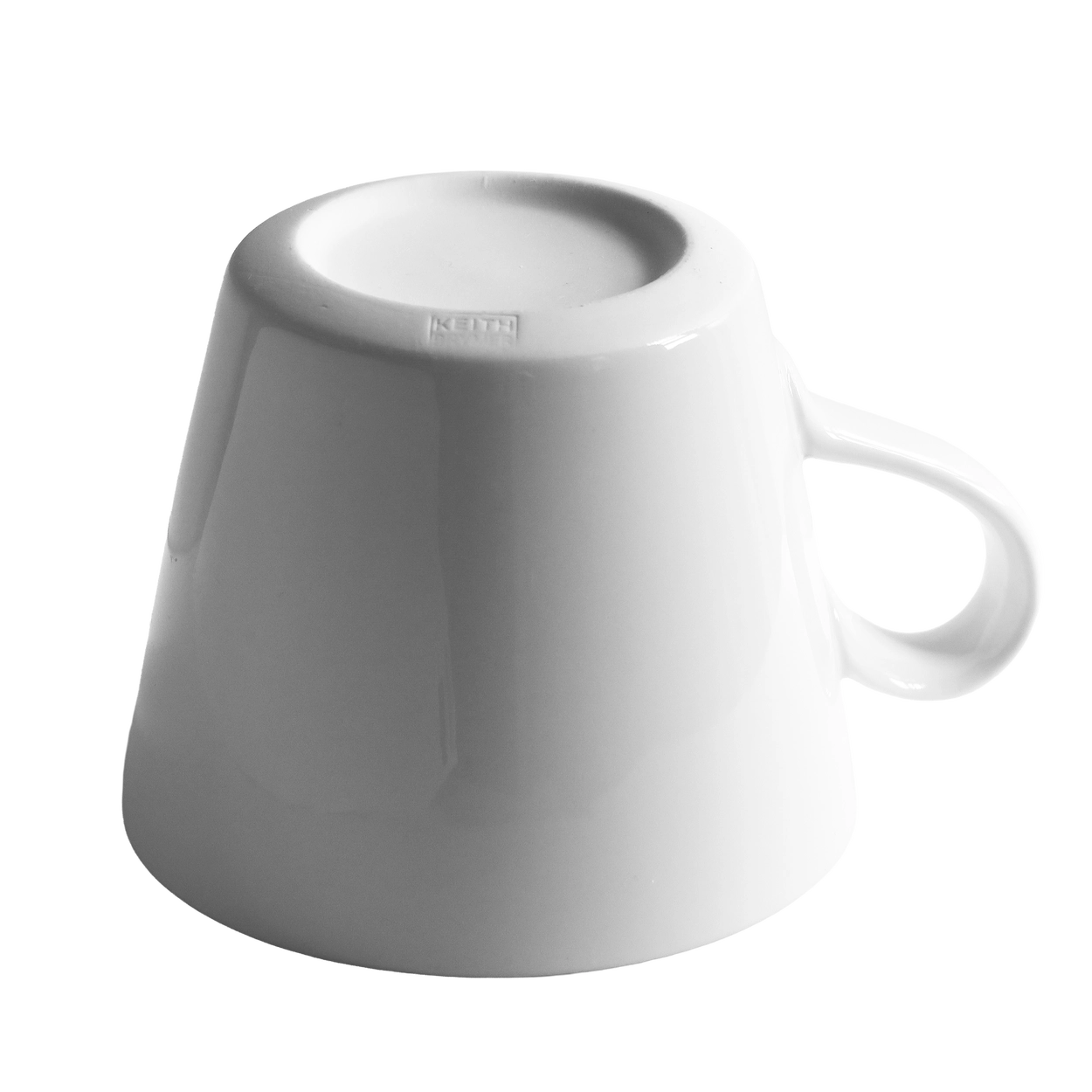 White mug with 'legend' text in red on a white background