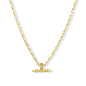 Gold necklace with a unique pendant on a white background