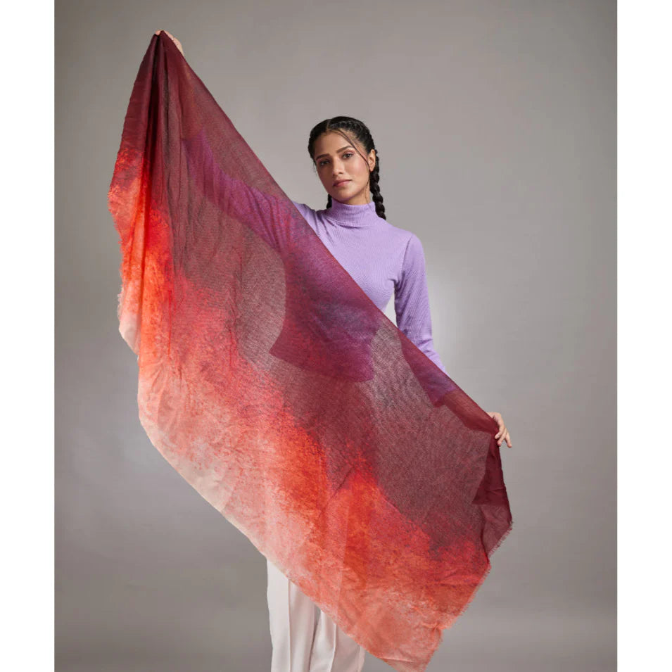 Red and orange scarf with a gradient effect on a white background
