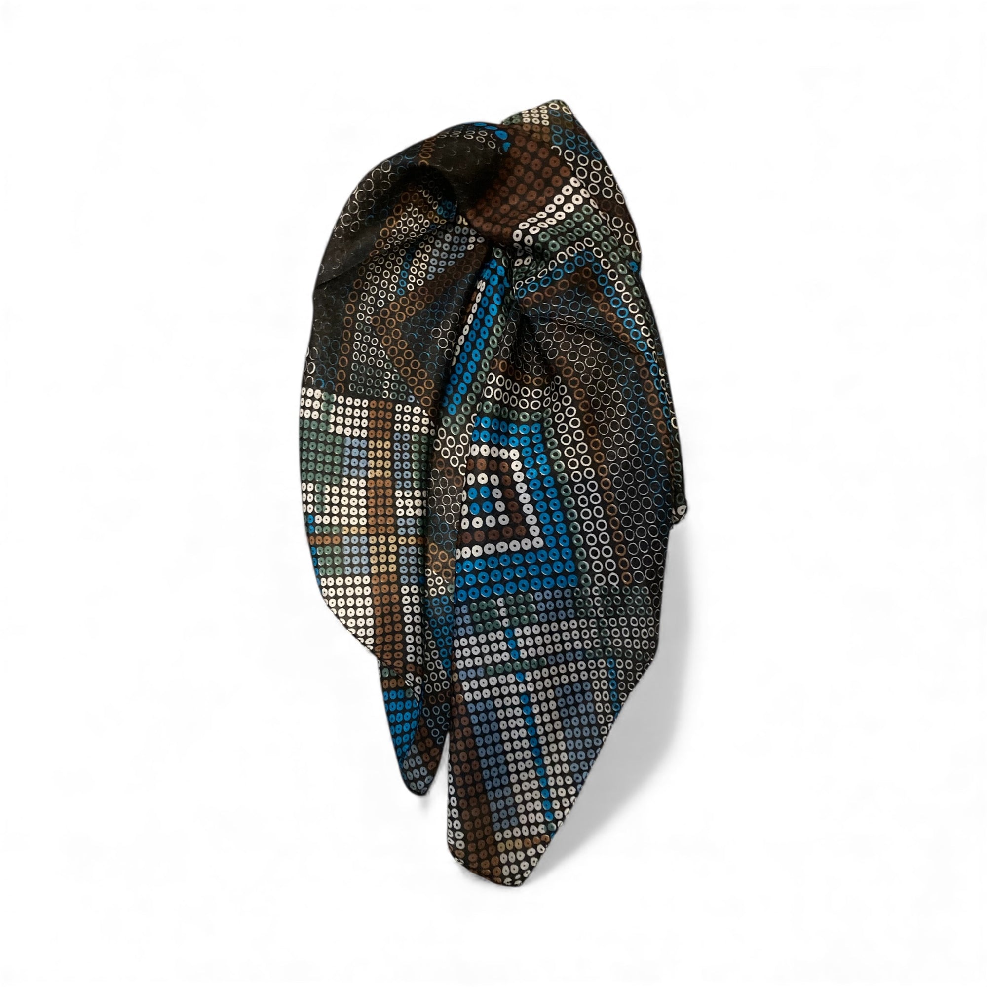 Decorative headscarf with geometric pattern on a white background