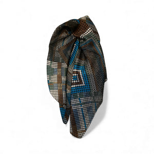 Decorative headscarf with geometric pattern on a white background