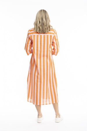 A woman viewed from behind wearing a midi-length orange and white vertically striped shirt dress with elbow-length sleeves, paired with white sneakers, against a plain white background.