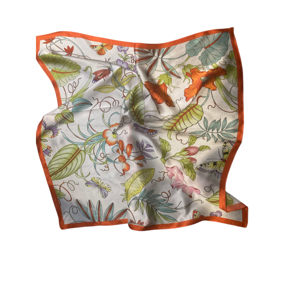 Floral patterned scarf with orange border on a white background