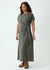 Woman wearing a green dress with a knot detail on a white background