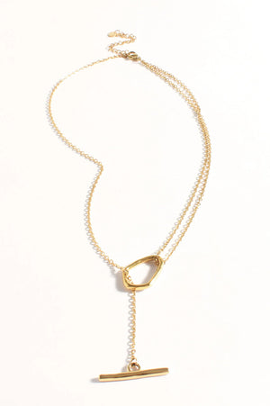 Gold necklace with a unique clasp on a white background