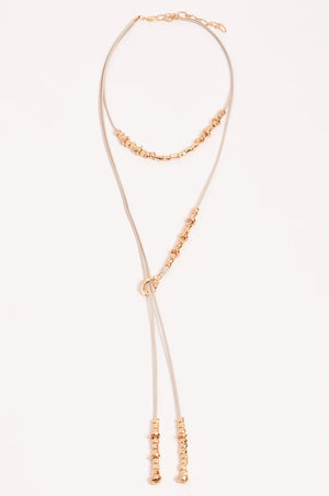 Rose gold necklace on a white background