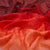 Close-up of red fabric with a textured pattern