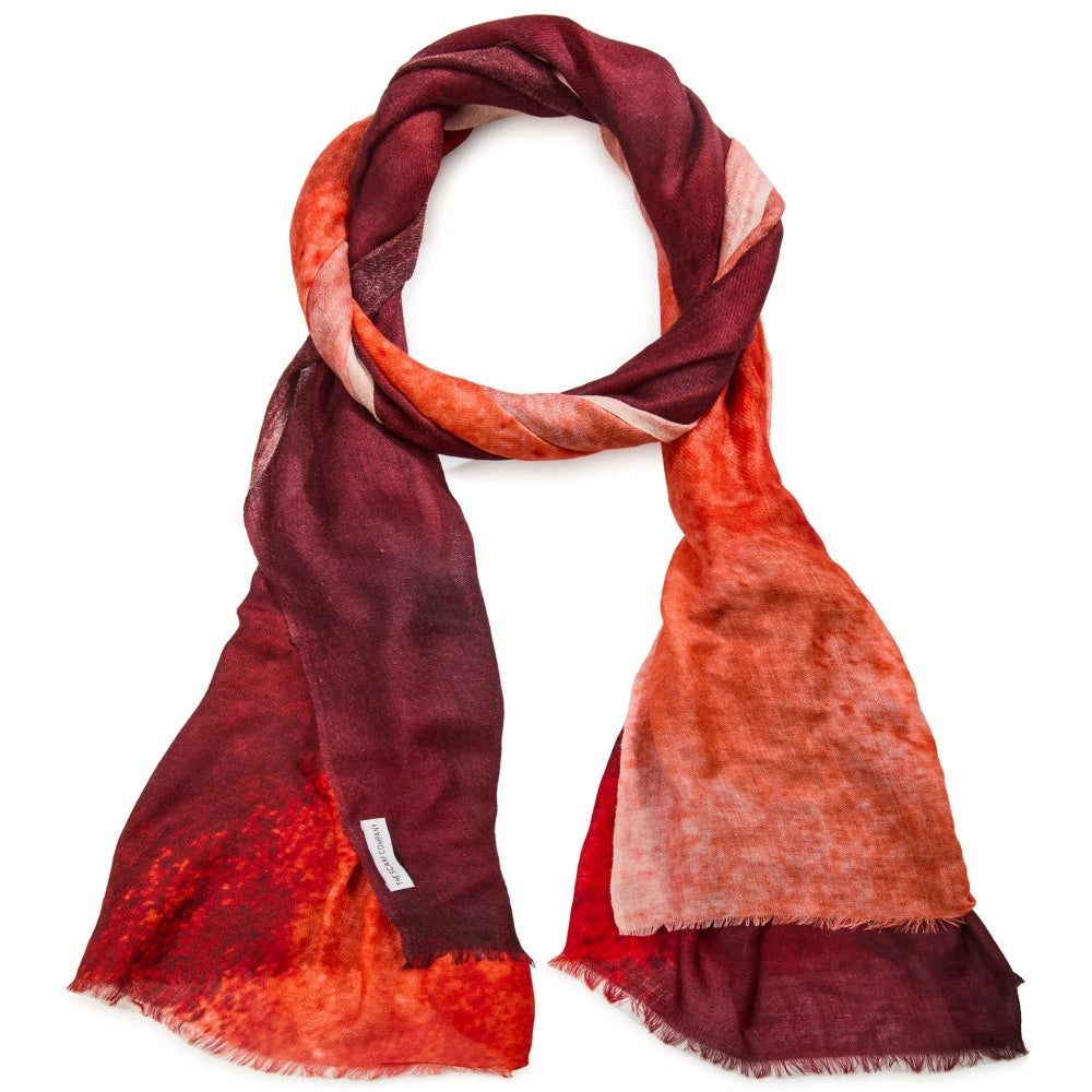 Red and orange scarf with a gradient effect on a white background