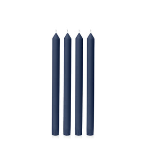 Set of five navy blue candles on a white background
