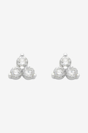Pair of silver earrings with clear gemstones on a white background