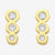 Gold earrings with clear gemstones on a white background