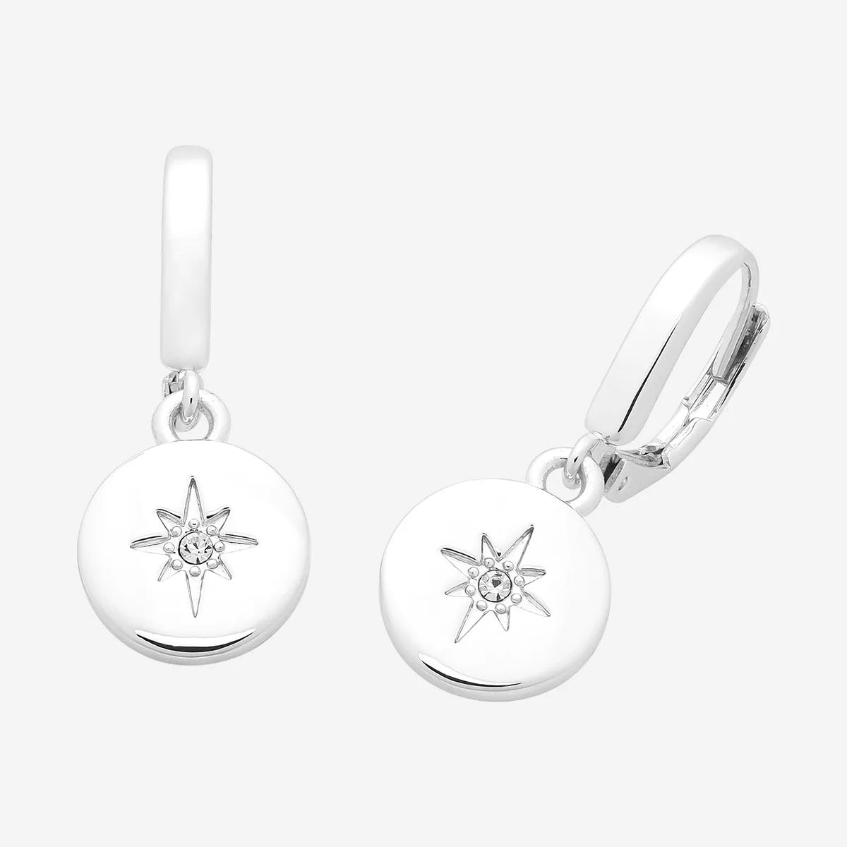 Pair of silver earrings with star designs on a white background