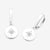 Pair of silver earrings with star designs on a white background