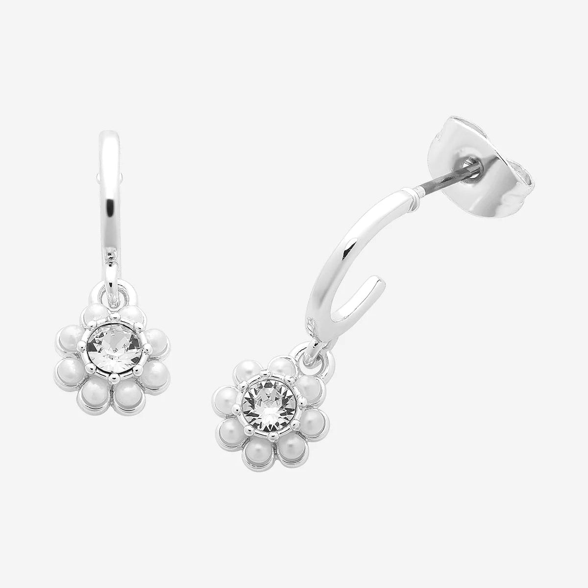 Gold hoop earrings with floral designs and clear gemstones on a white background