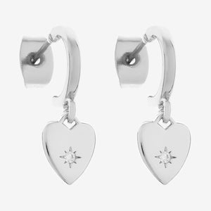Silver heart-shaped earrings with star details on a white background