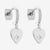 Silver heart-shaped earrings with star details on a white background