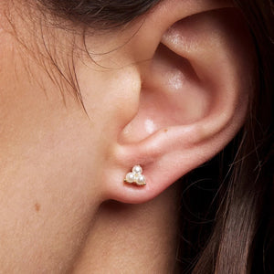 Close-up of an ear wearing a pearl earring