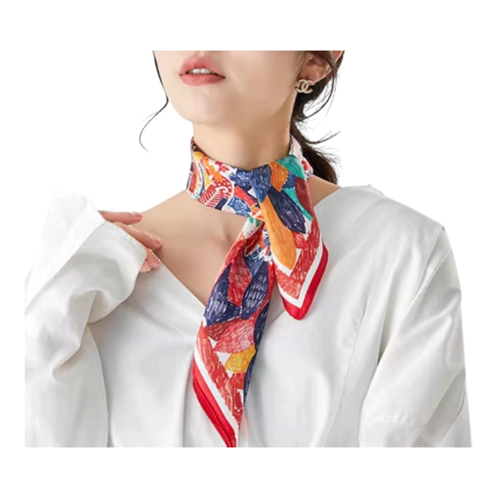 A woman wearing a white blouse and a colorful patterned silk neck scarf tied around her neck, shown against a plain white background.