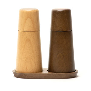 Wooden salt and pepper shakers with  on a white background