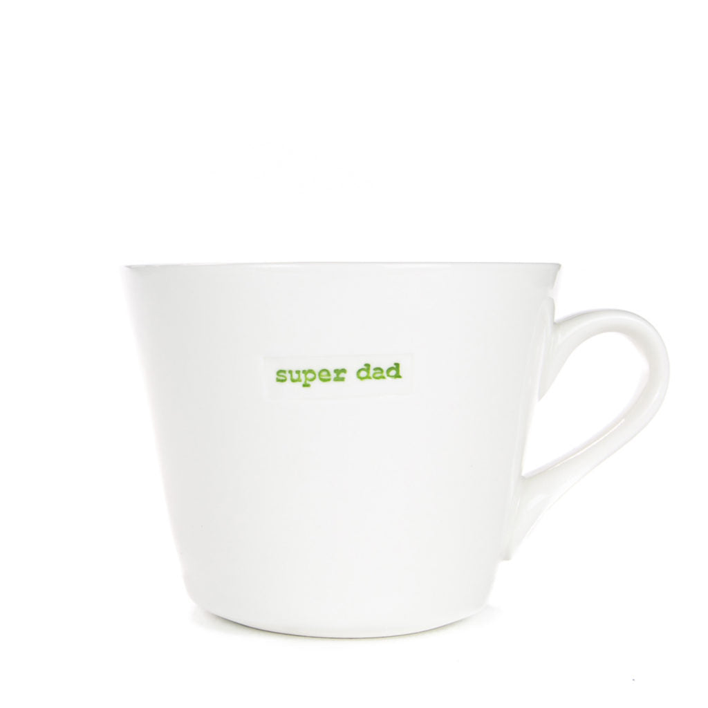 White mug with 'super dad' text in green on a white background