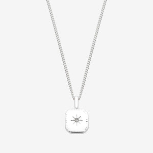 Silver necklace with a square pendant on a white background