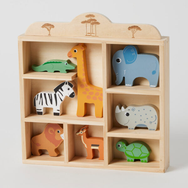 Wooden toy shelf with animal figurines on a light gray background