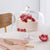 Alto Cake Server-Gold and timber-Shown with decorated cake