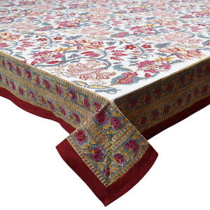 Decorative tablecloth with floral pattern and red border on a white background