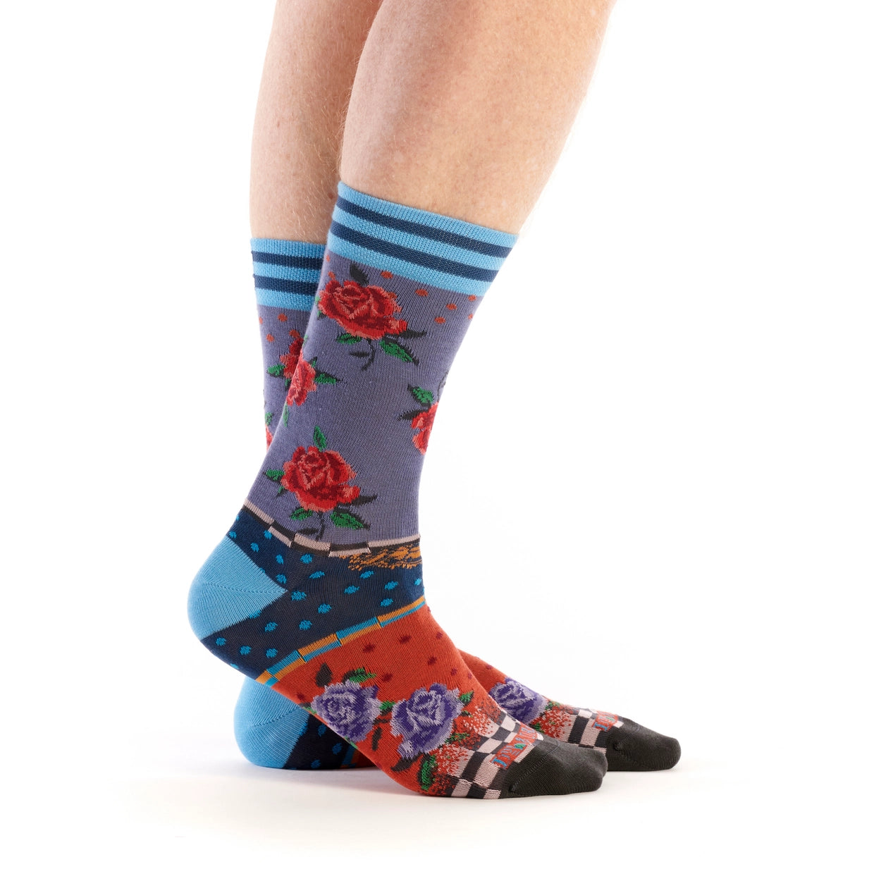 Colorful floral-patterned socks worn by a person on a white background