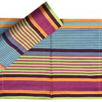 Colorful striped placemat with a pattern of horizontal lines in various colors on a white background.